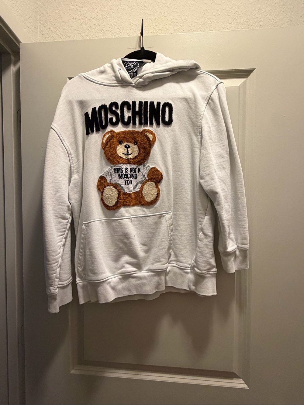 Moschino White Hoodie with Brown Teddy Patch and Black Logo